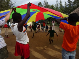 Fun and games with the parachute at Mier Pamoja Care Centre